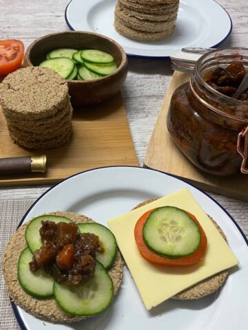 Scottish Vegan Oatcakes on a plate with salad and chutney toppings.