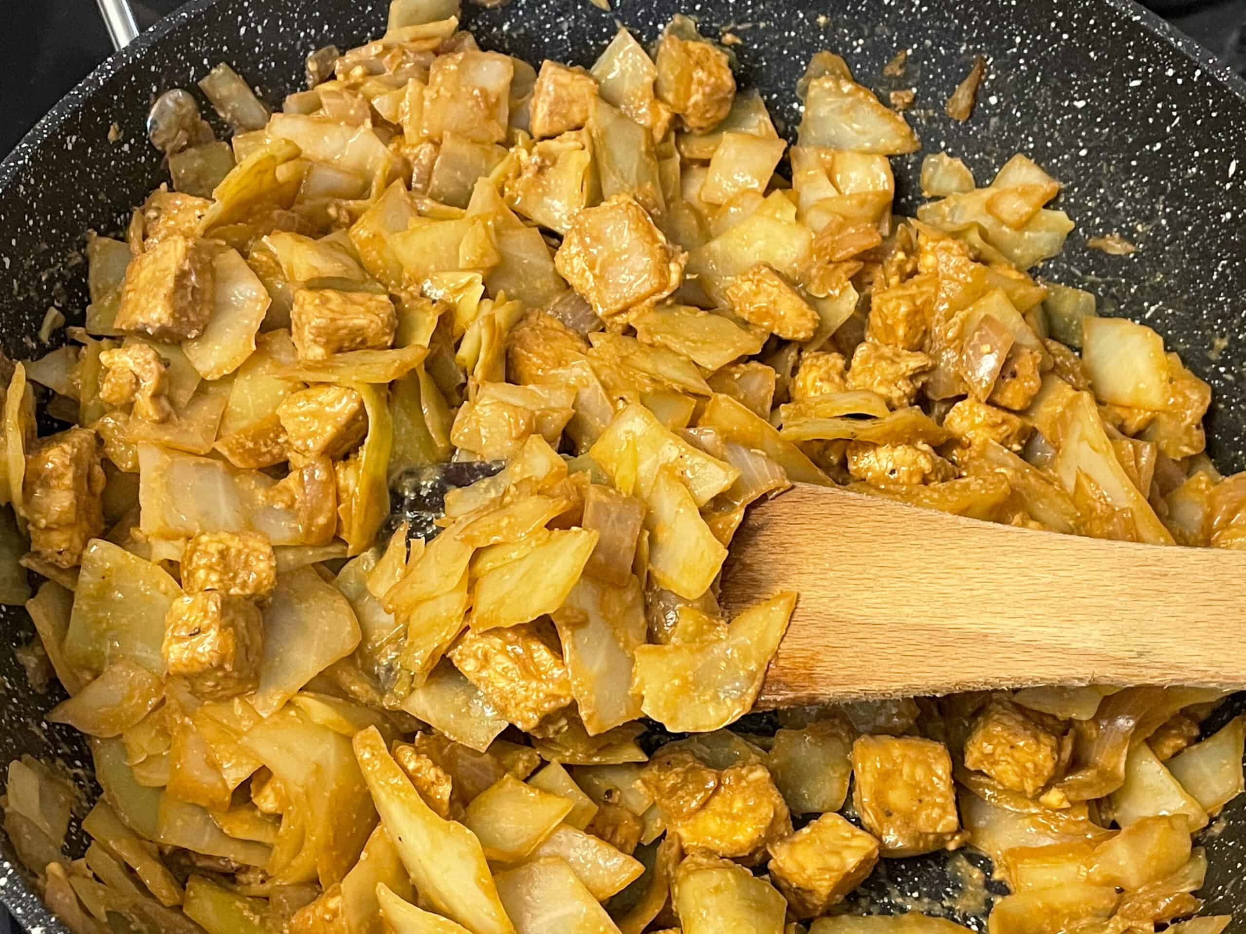 cooked ingredients for vegan hash in pan.