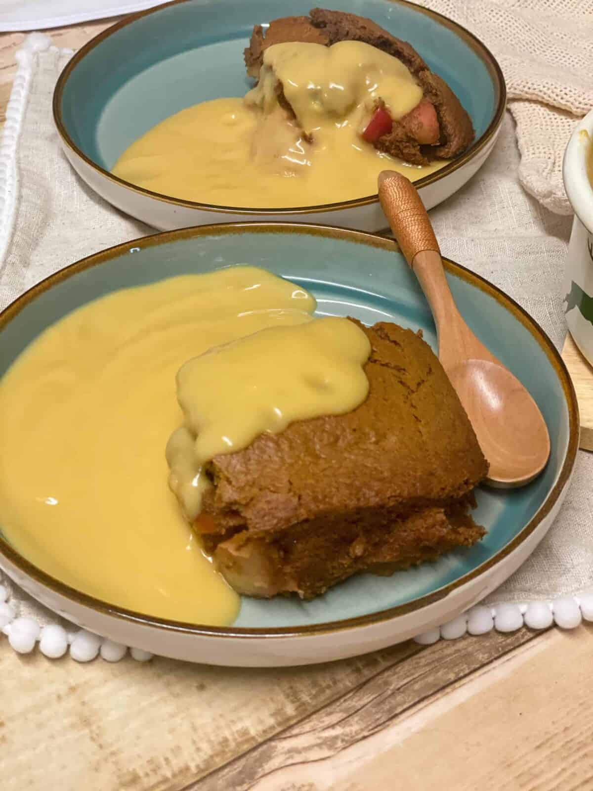 Vegan Eve's pudding served with custard, featured image.