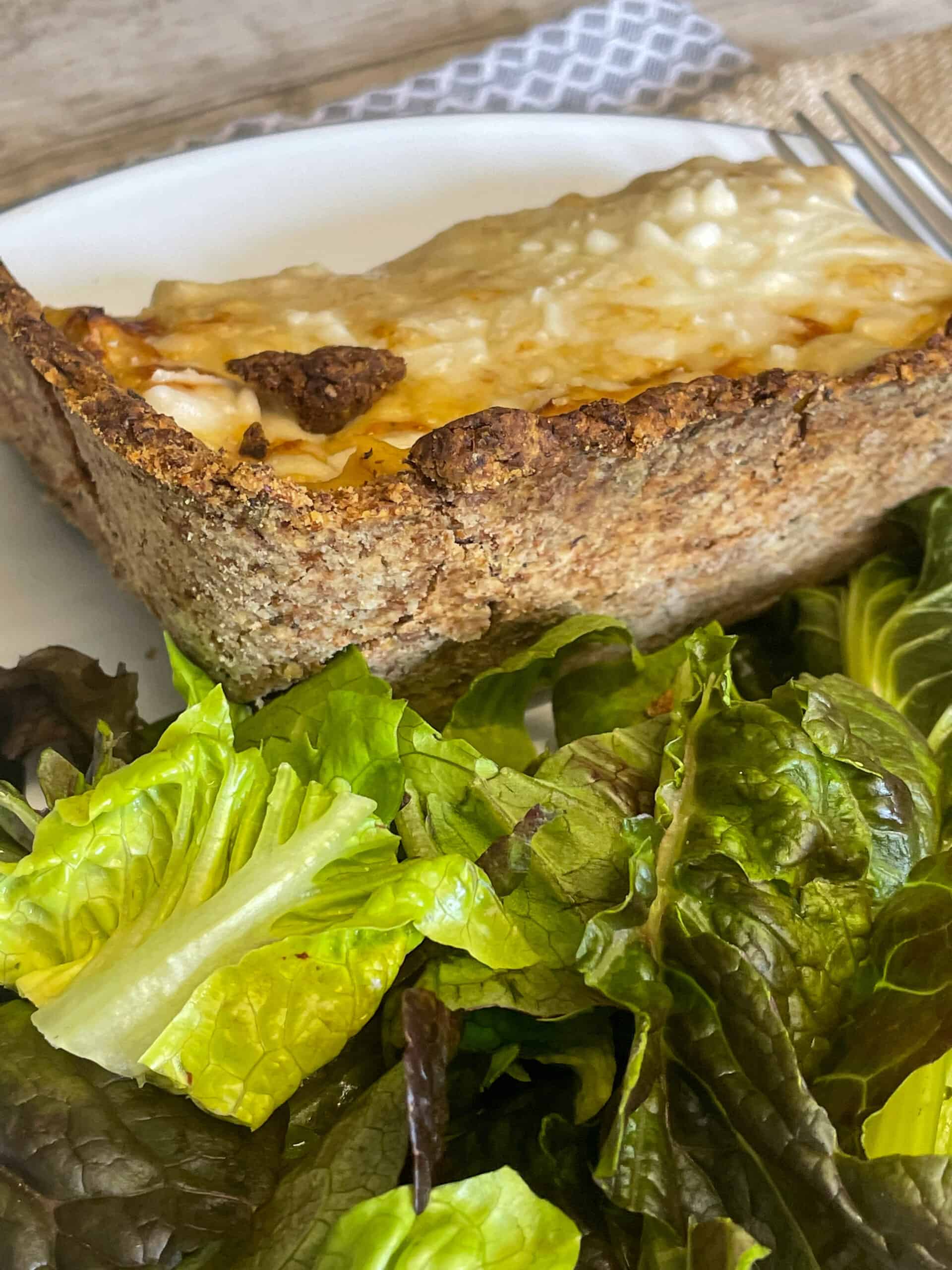 Back view of wholemeal crust with salad leaves.