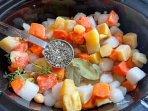 root veggies, bay leaf and mixed dried herbs in the pan.