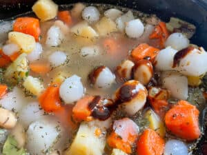 root veggies in pan with vegetable extract added.