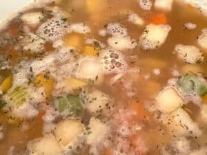 vegetable stock added to the pan of potage stew.