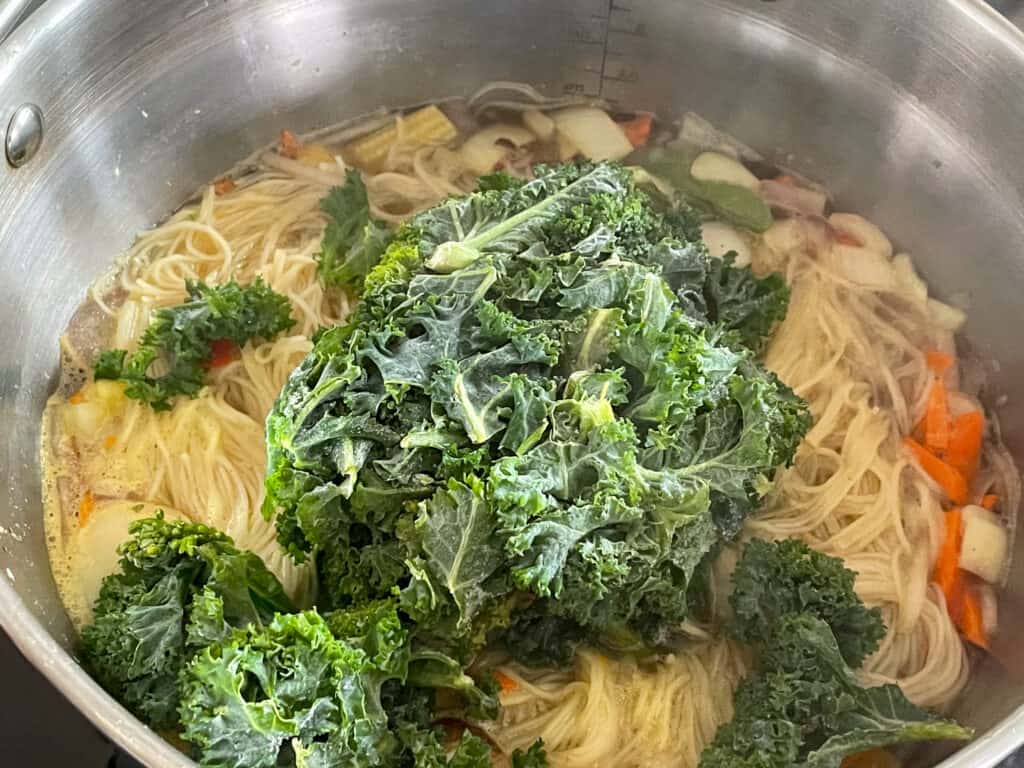 frozen kale added to the stir-fry soup.