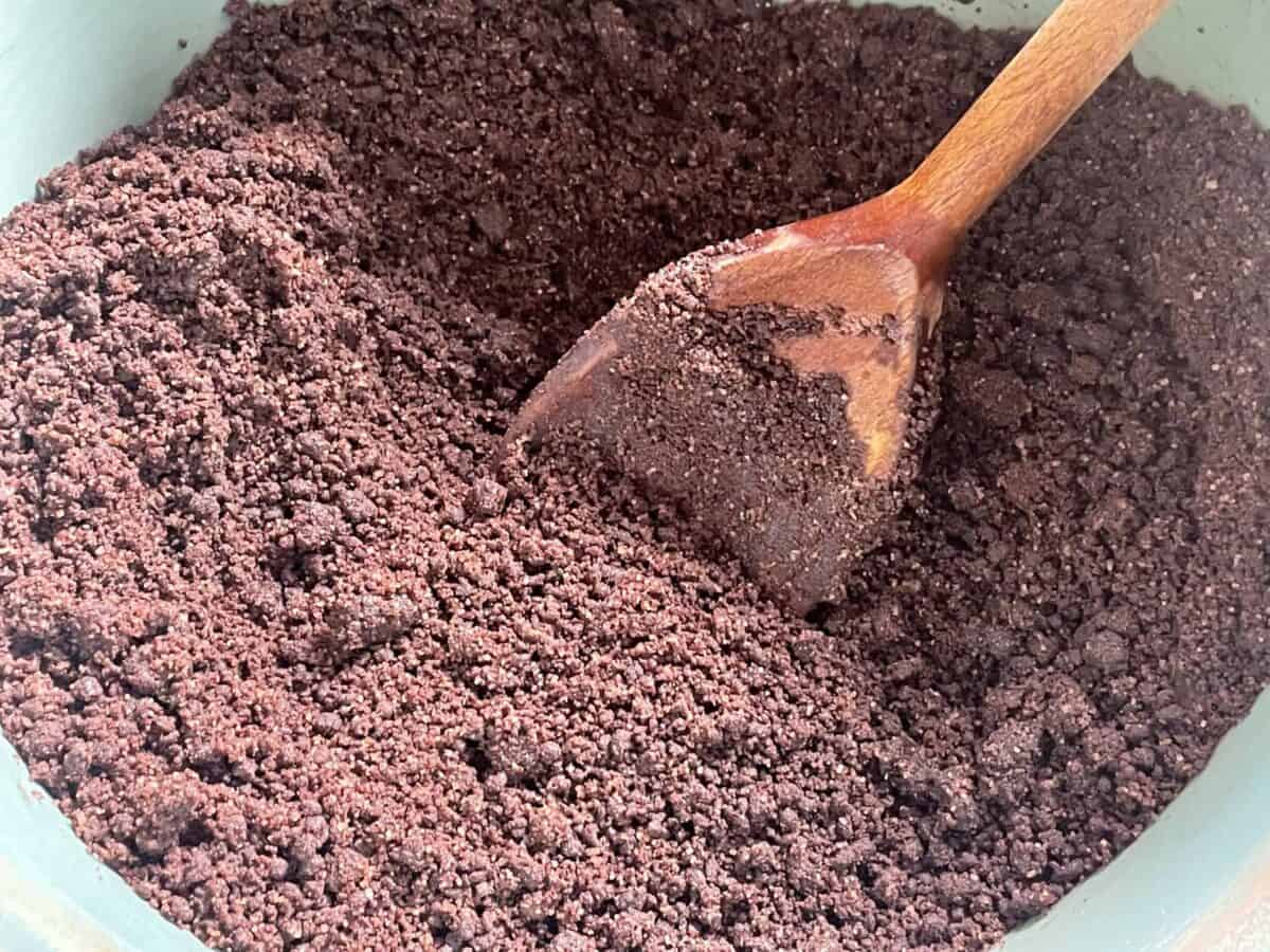 Flour mix turned into crumbs with wooden spoon.