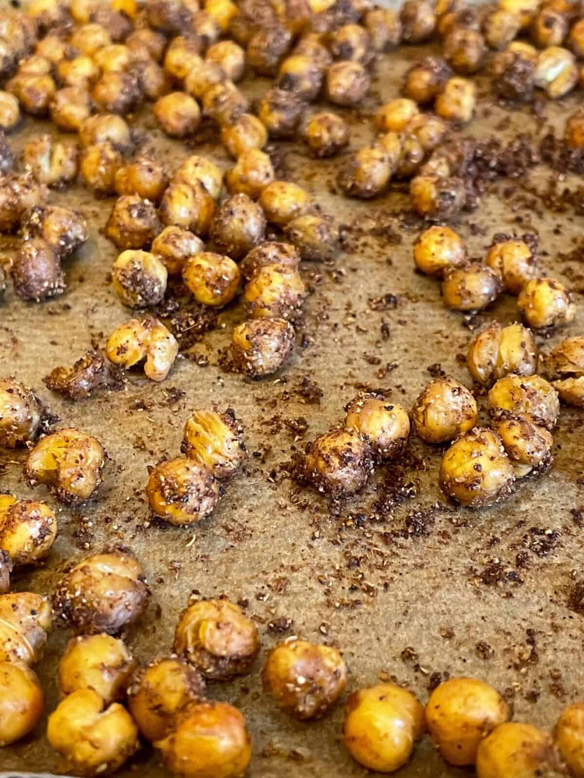 Chickpeas roasted and ready to use, on baking tray.