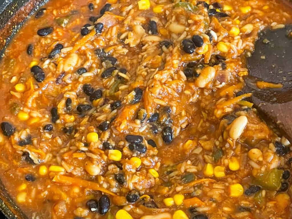 black beans, white kidney beans, tomato passata and veggie stock added to the casserole pan.
