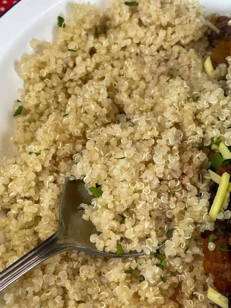 quinoa cooked and served in white bowl with chilli.