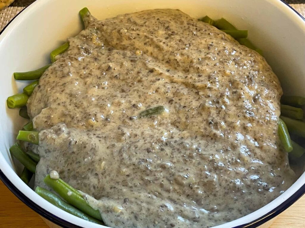 Mushroom sauce poured over the green beans in casserole.