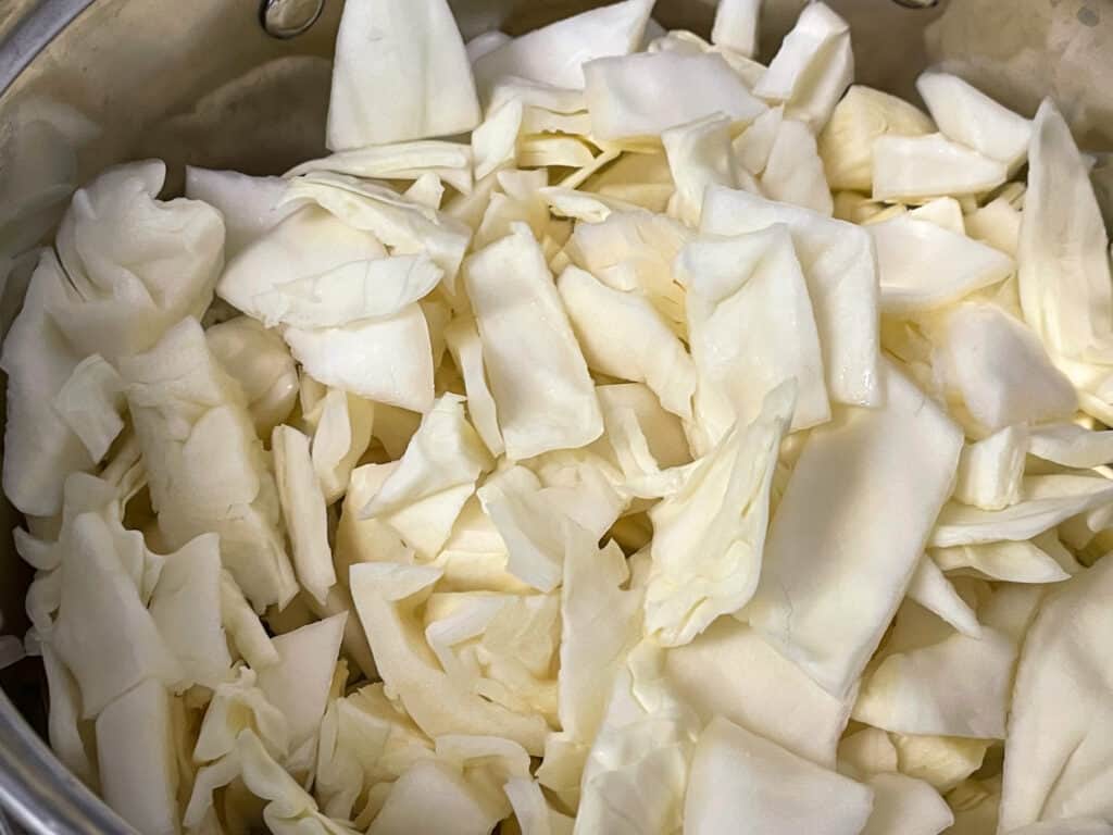 cabbage sliced and in steaming pan.