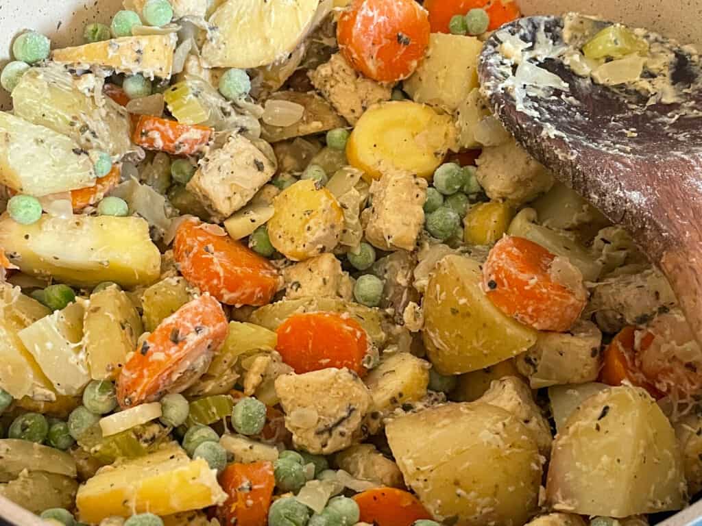 Flour mixed through veggies in pot.