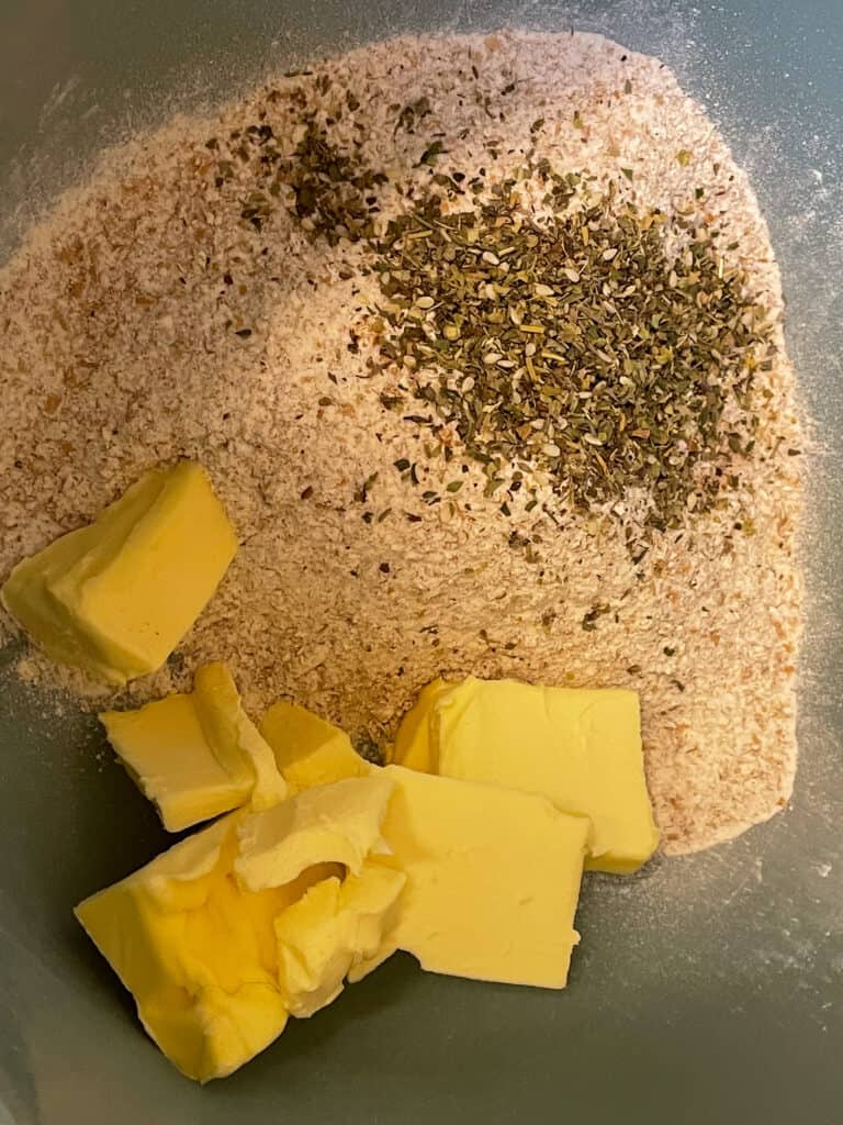 vegan butter, flour and herbs added to mixing bowl.