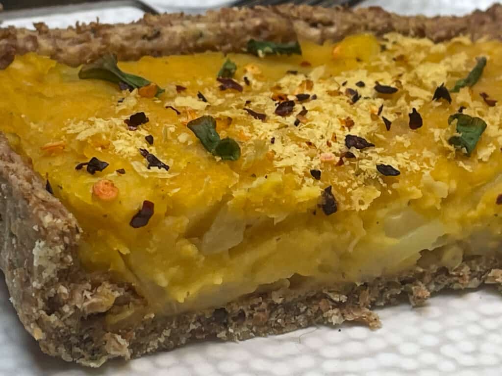 A slice of baked harvest pie on a serving plate.