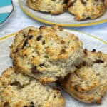 featured image for vegan Jamaican rock cakes close up, 2 plates of buns with third plate to side.