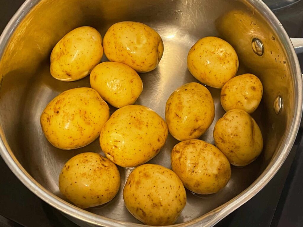 new potatoes in saucepan.