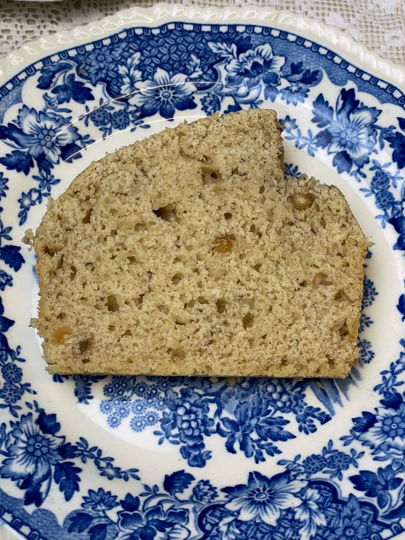 A close up of peanut butter bread on a blue patterned vintage plate.