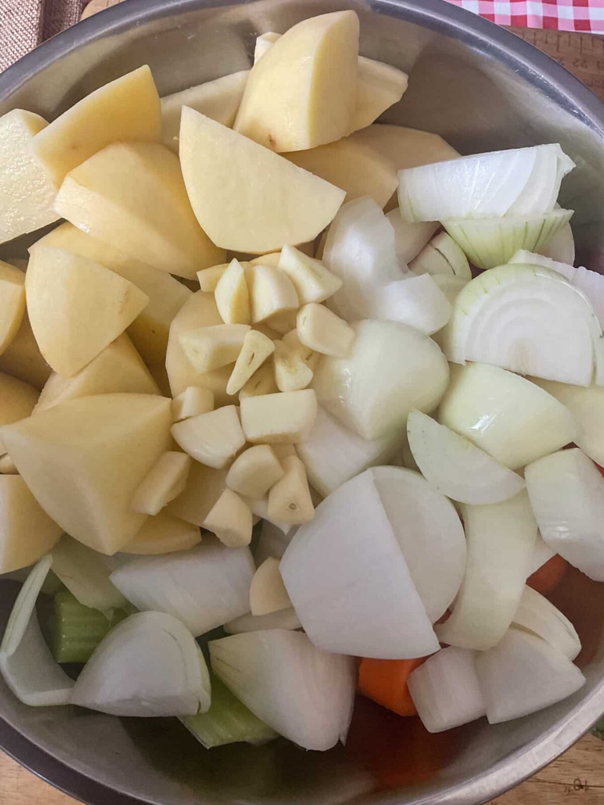 Chopped potatoes, onions and garlic for stew.