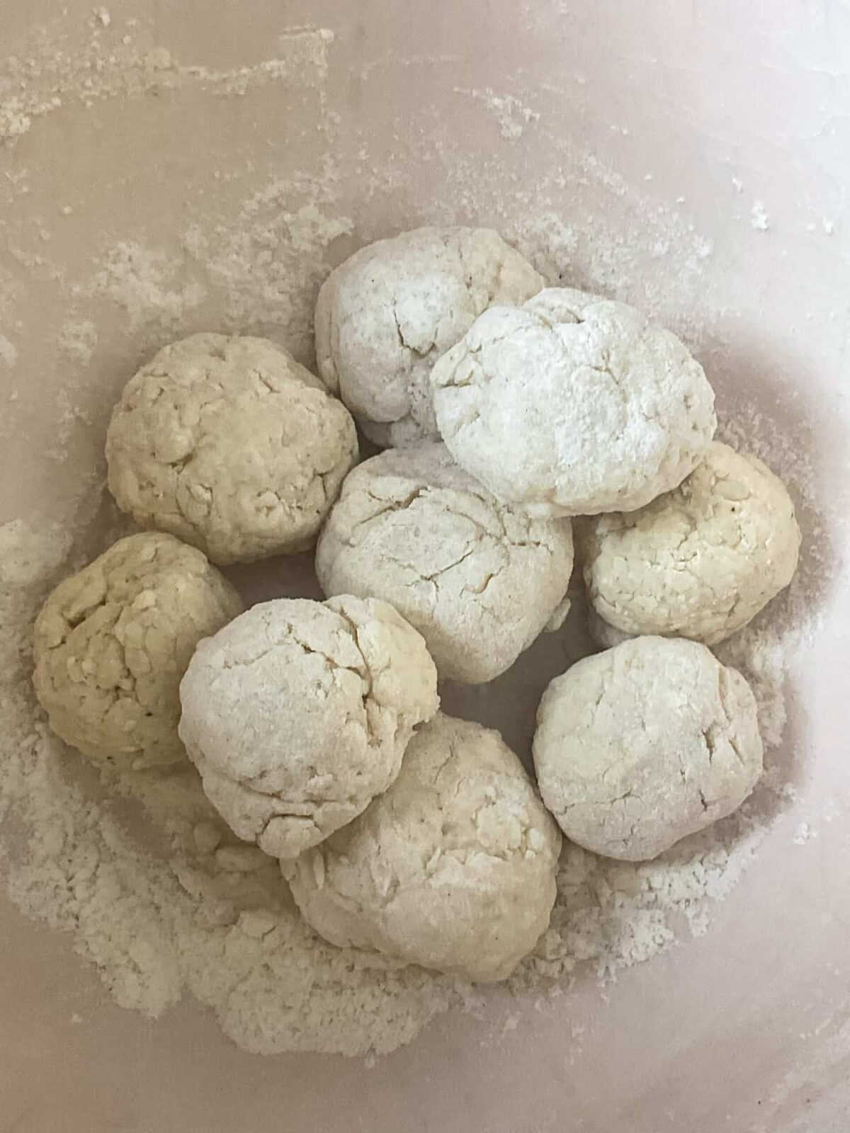 Nine dumpling balls in mixing bowl.