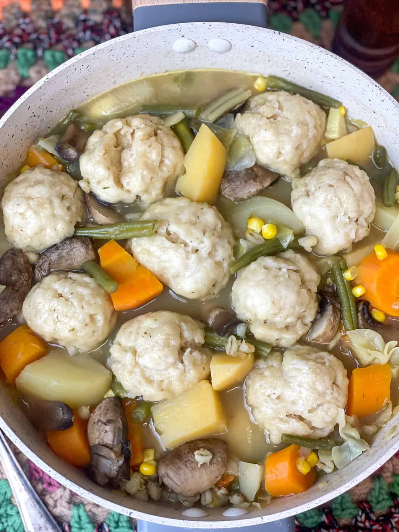 Cooked dumplings in stew pot.