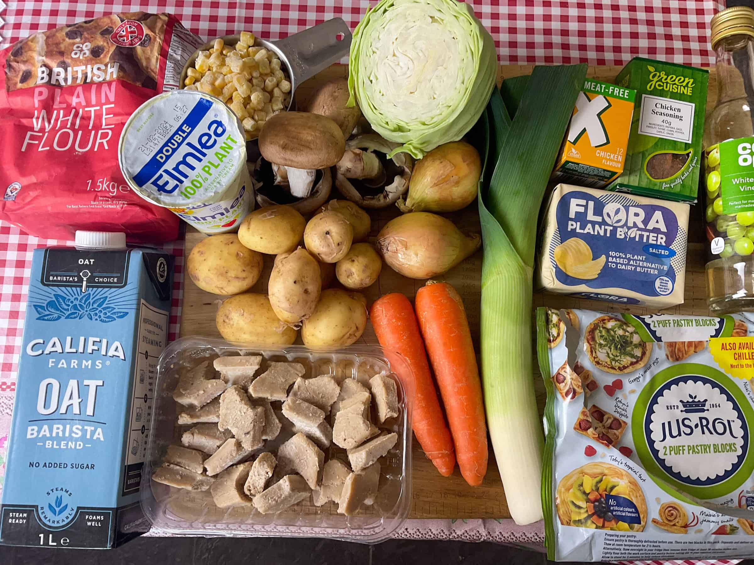 Ingredients on wooden board for vegan chicken pie.