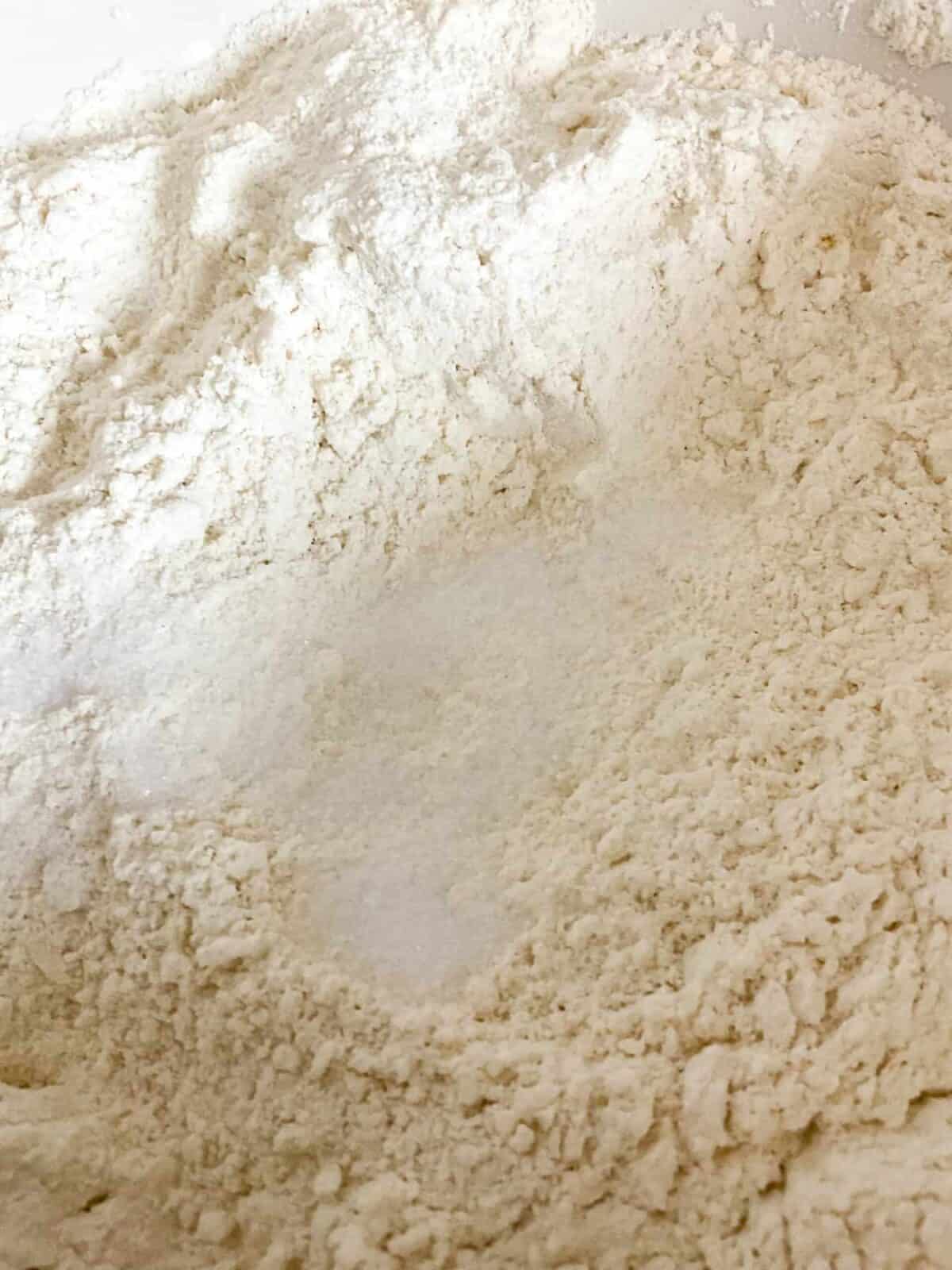 Salt added to flour mixture in bowl.