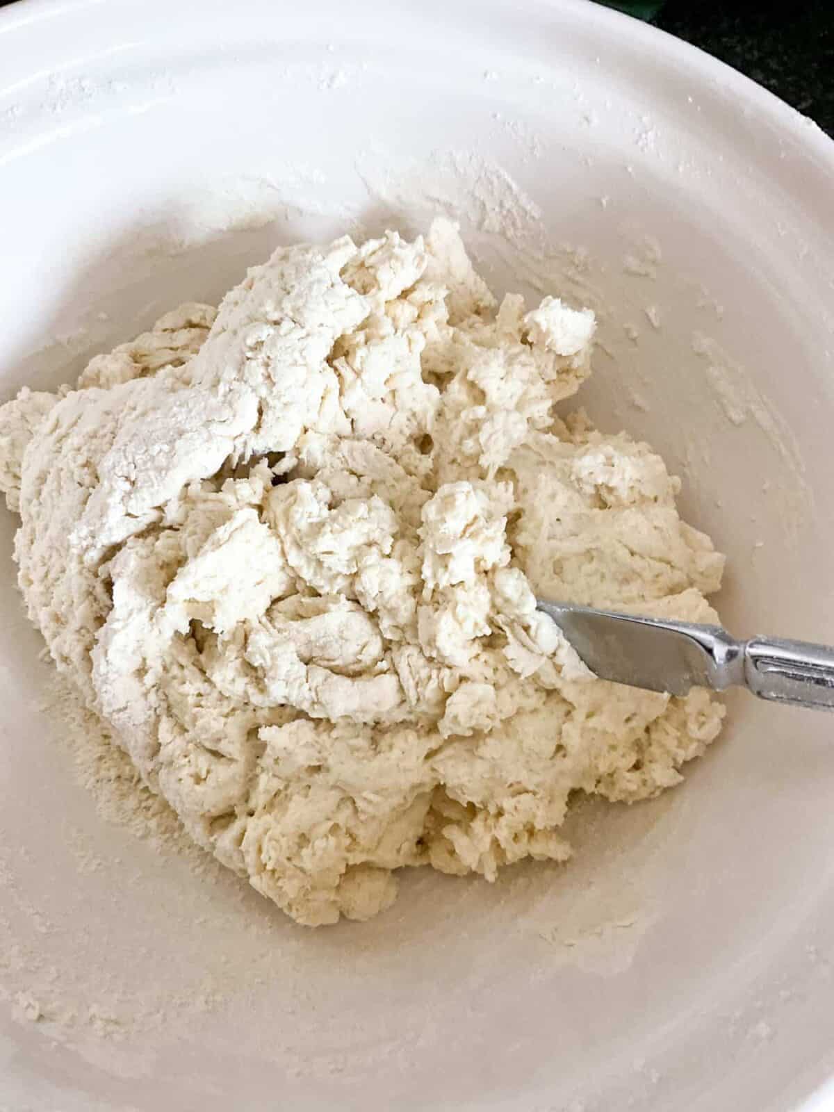 Bread ingredients mixed together to form a dough.