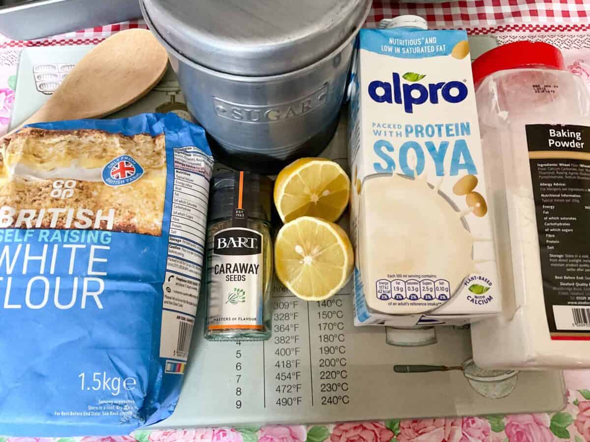 Ingredients for seed cake on cutting board.