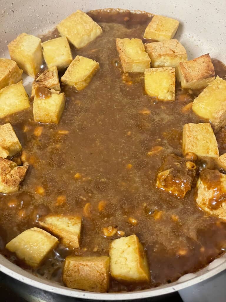 brown sauce added to pan of tofu.