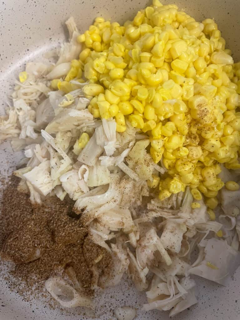jackfruit, sweetcorn and spice powder in a cream coloured pot.