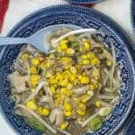 Soup served in blue patterned bowl with blue spoon, featured image.