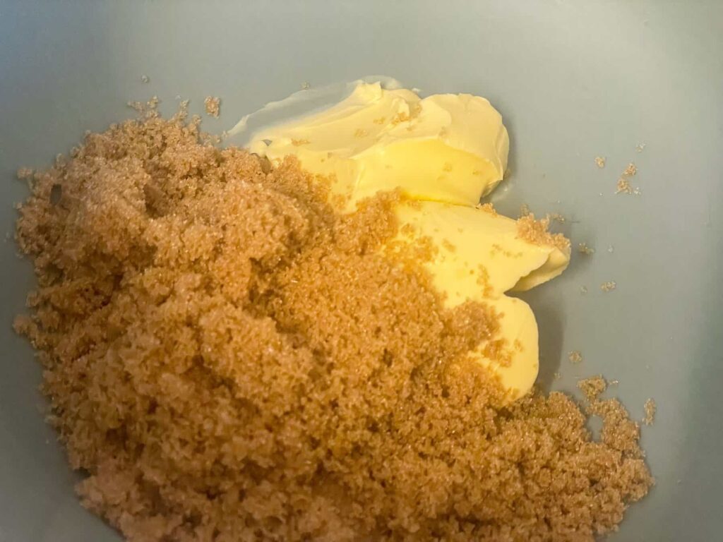 Brown sugar and margarine added to mixing bowl.