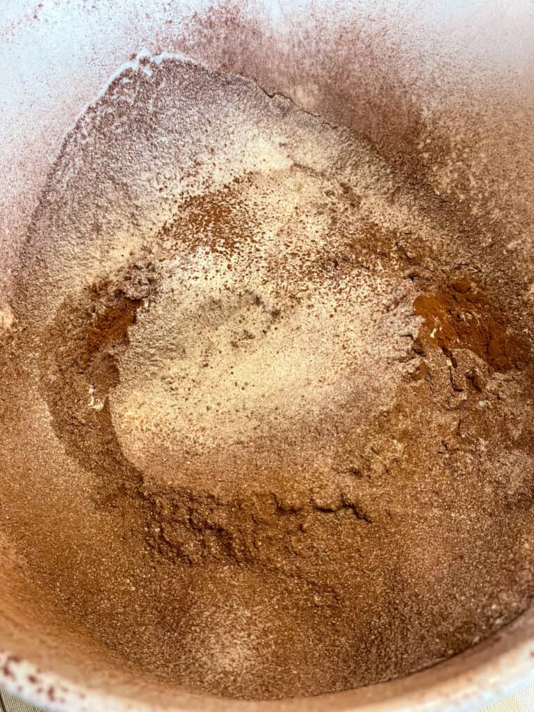 dry ingredients added to mixing bowl for chocolate pancakes.