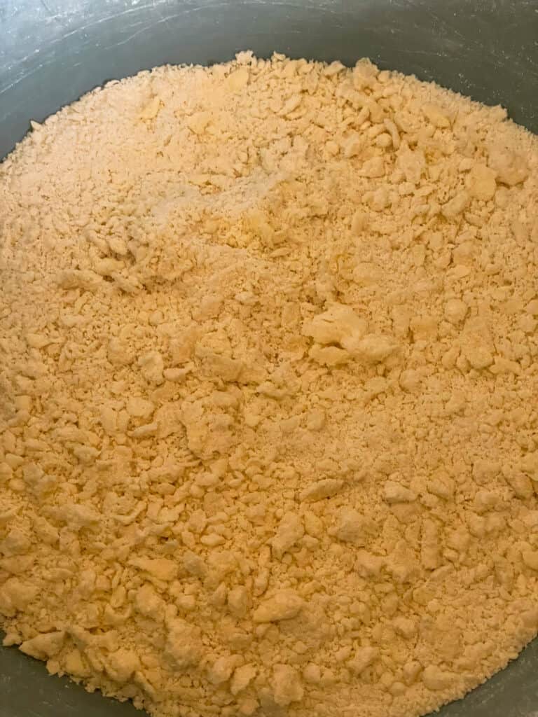 margarine rubbed into dry ingredients to create breadcrumb texture in mixing bowl.