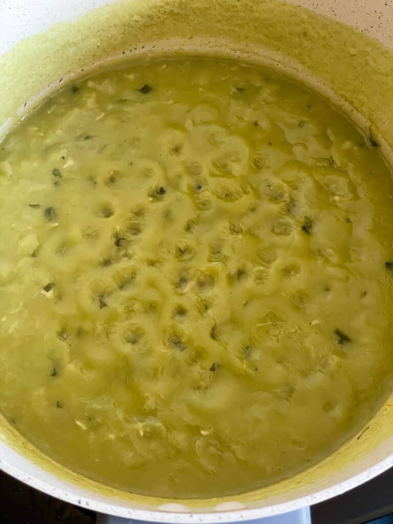 mushy peas cooked with the peas thickened and ready to season.