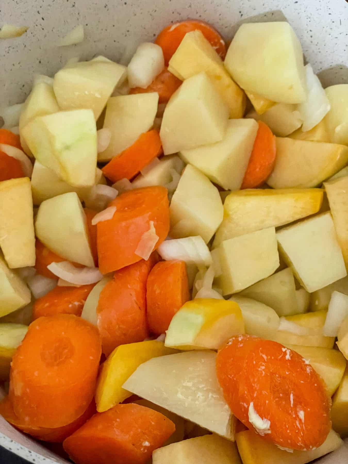 More vegetables added to soup pot.