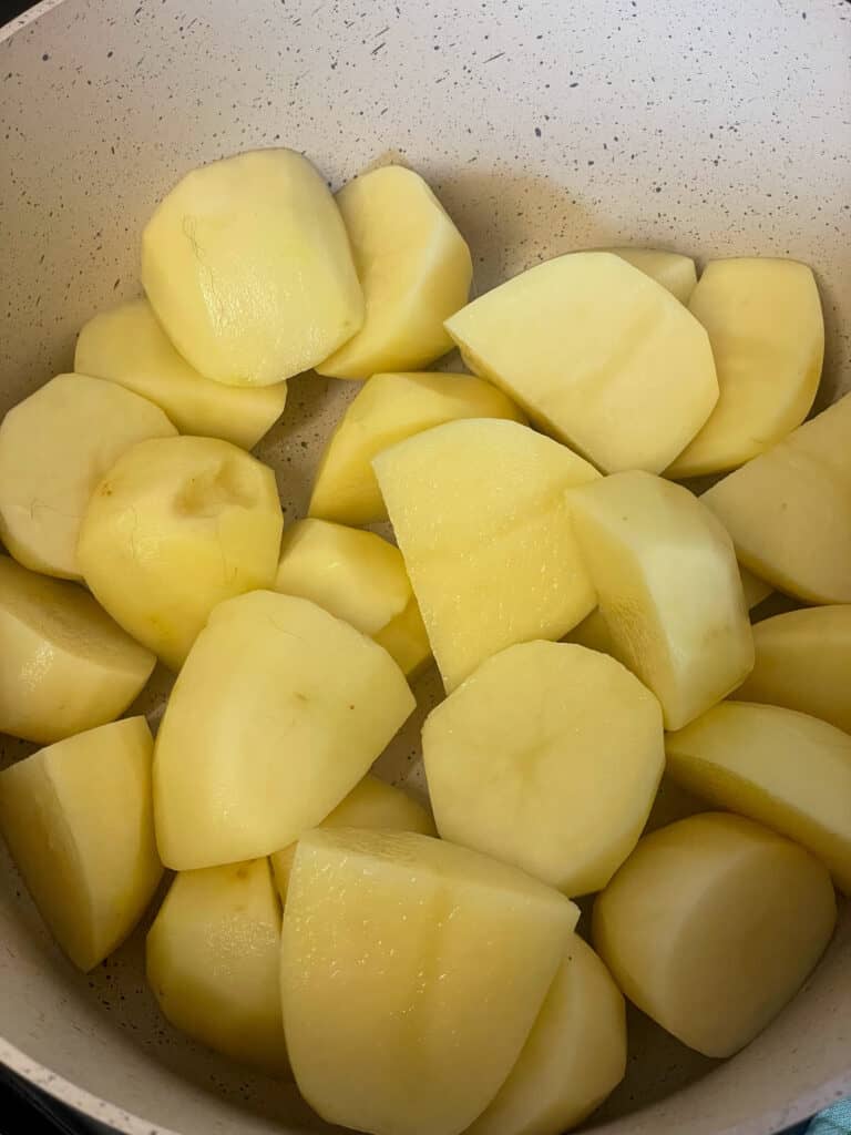 potatoes chopped into chunks and placed in the soup pot.
