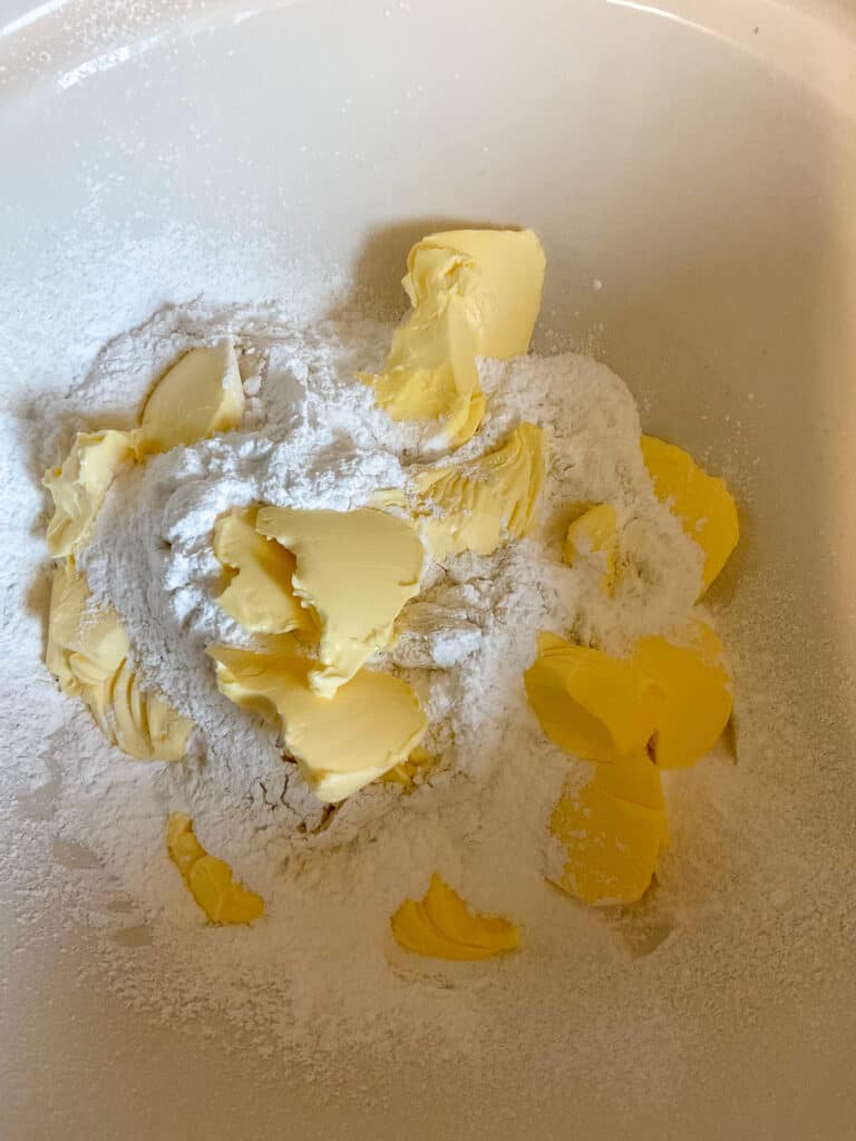 flour, sugar and margarine added to mixing bowl.