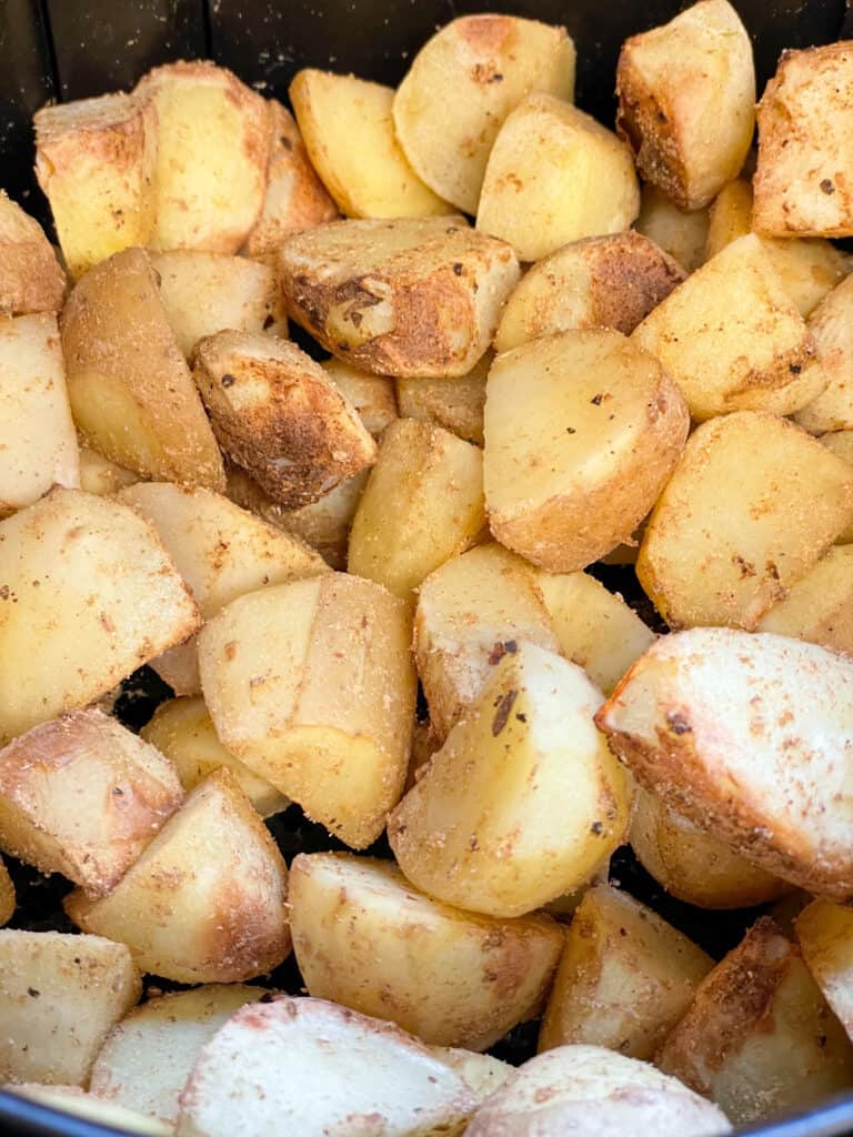 potatoes cooking for Aloo Gobi, in an air-fryer.
