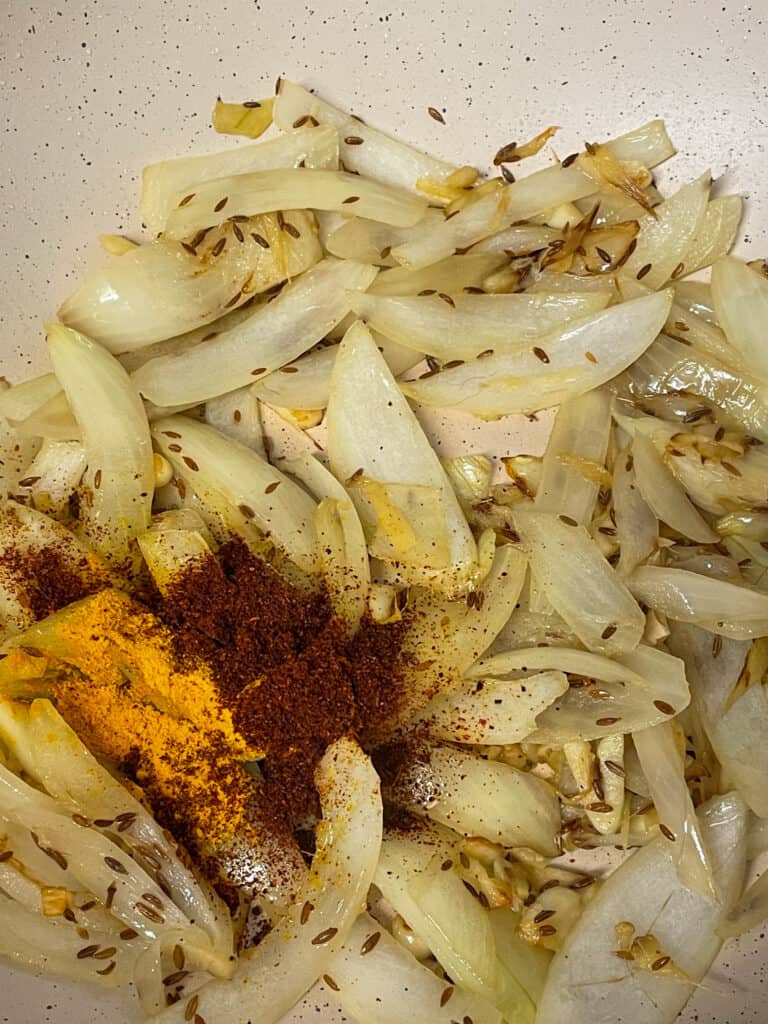 curry, chilli powders, turmeric added to pan along with the onions.