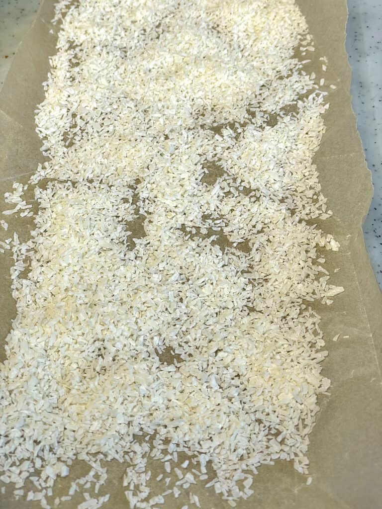 desiccated coconut sprinkled over greaseproof paper.