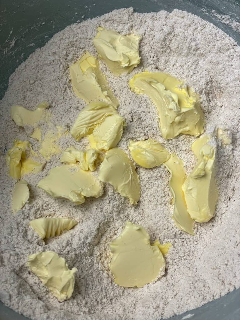 margarine added to flour mixture in bowl.