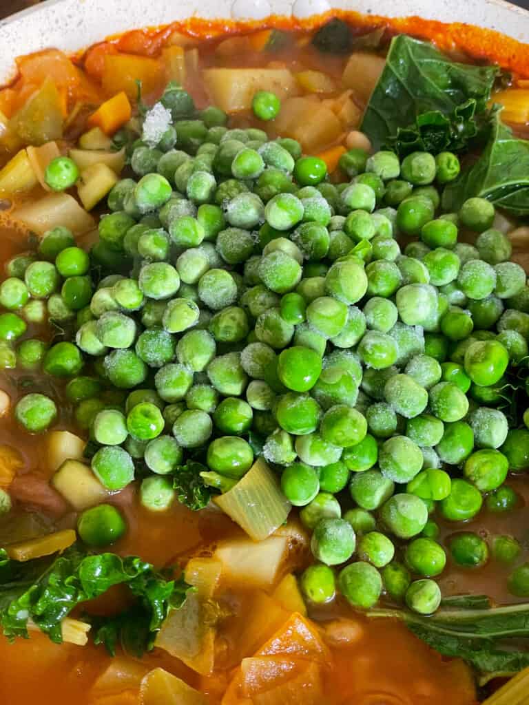 peas added to cabbage and kale soup.