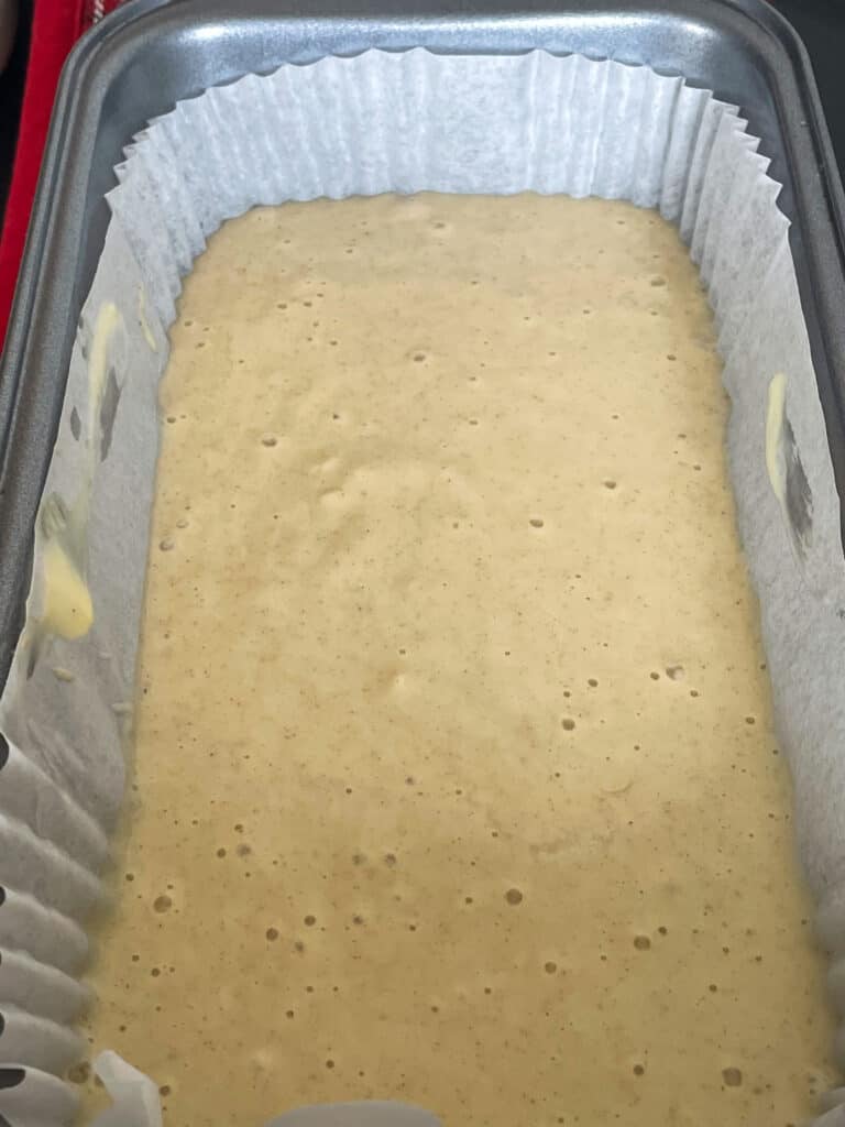 syrup loaf batter poured into loaf baking pan.