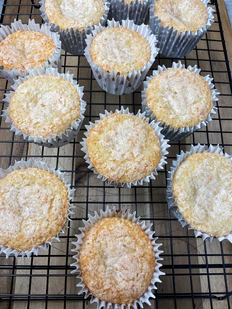 coconut buns cooling on a wire rack.