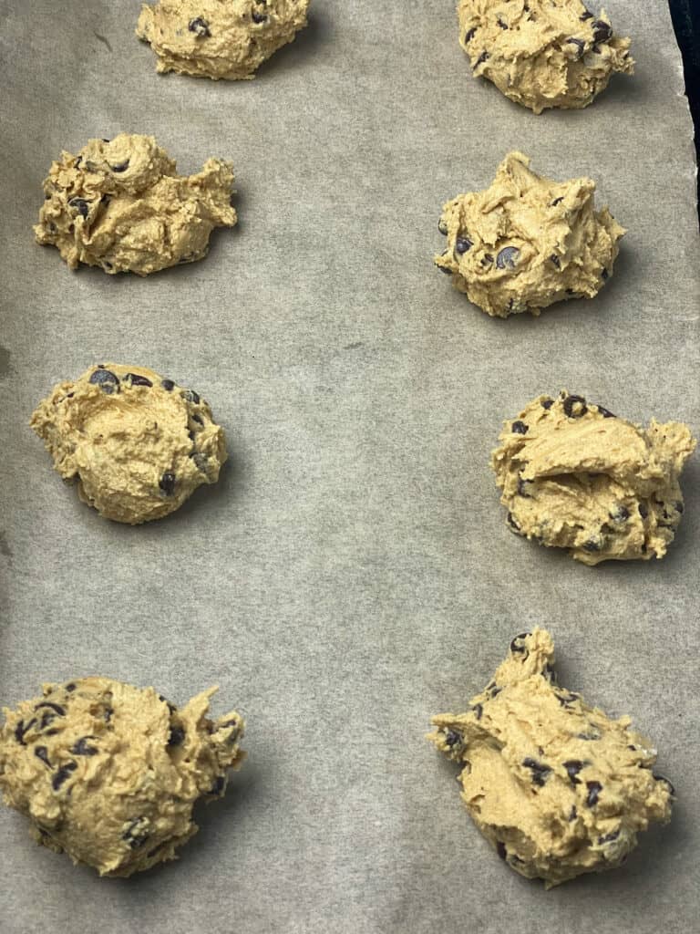 Cookie dough on baking tray ready to bake.