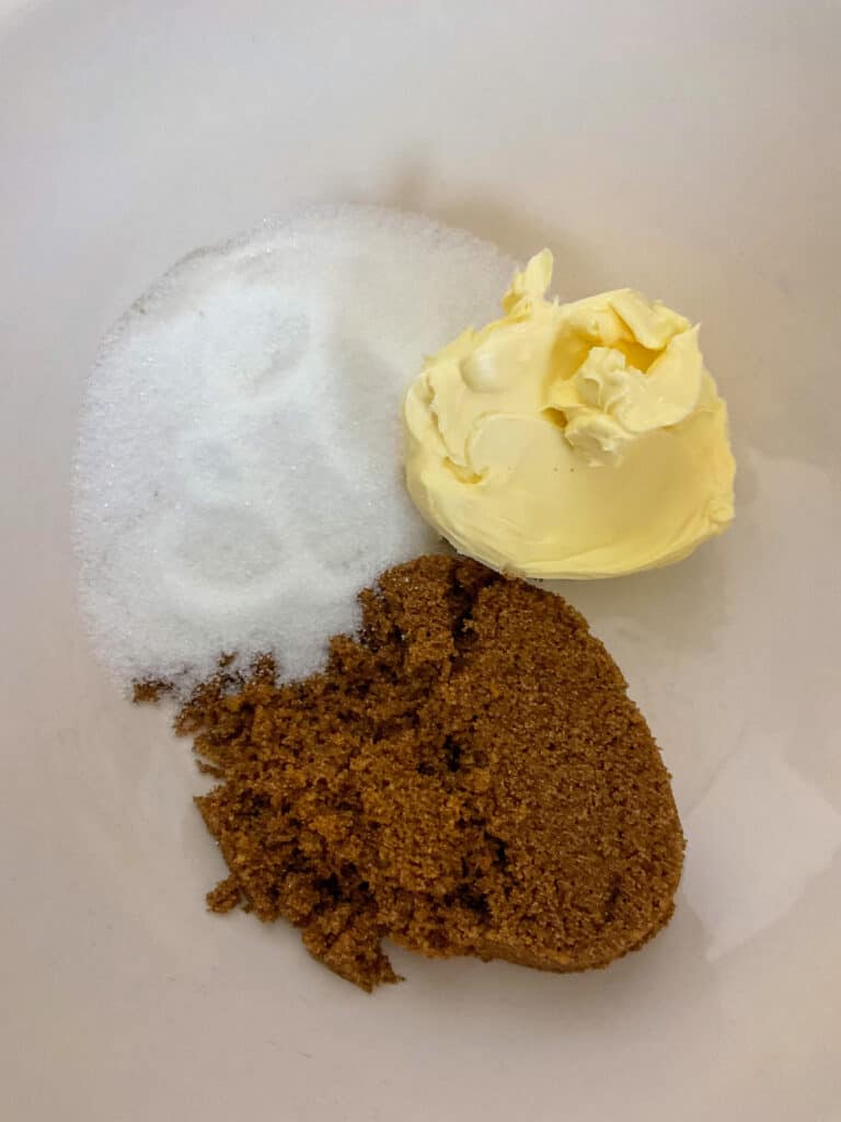sugars and margarine in mixing bowl for peanut butter cookies.
