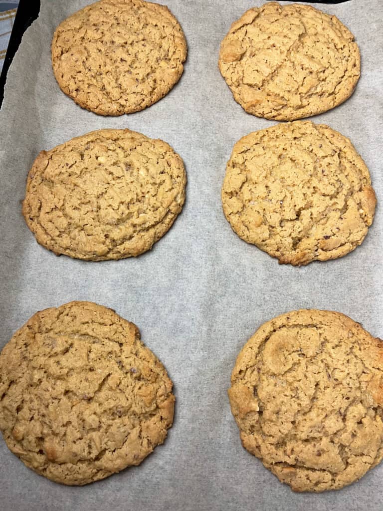 old-fashioned peanut butter cookies baked and cooling on baking tray.