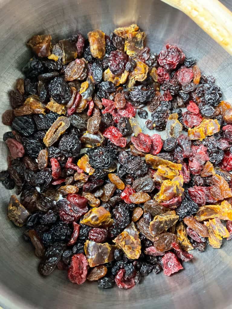 dried fruit added to saucepan for dried fruit crumble.