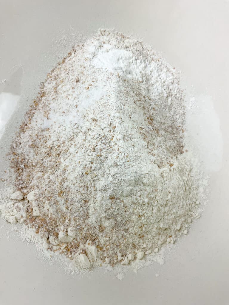 Wholemeal flour and plain flour added to mixing bowl.