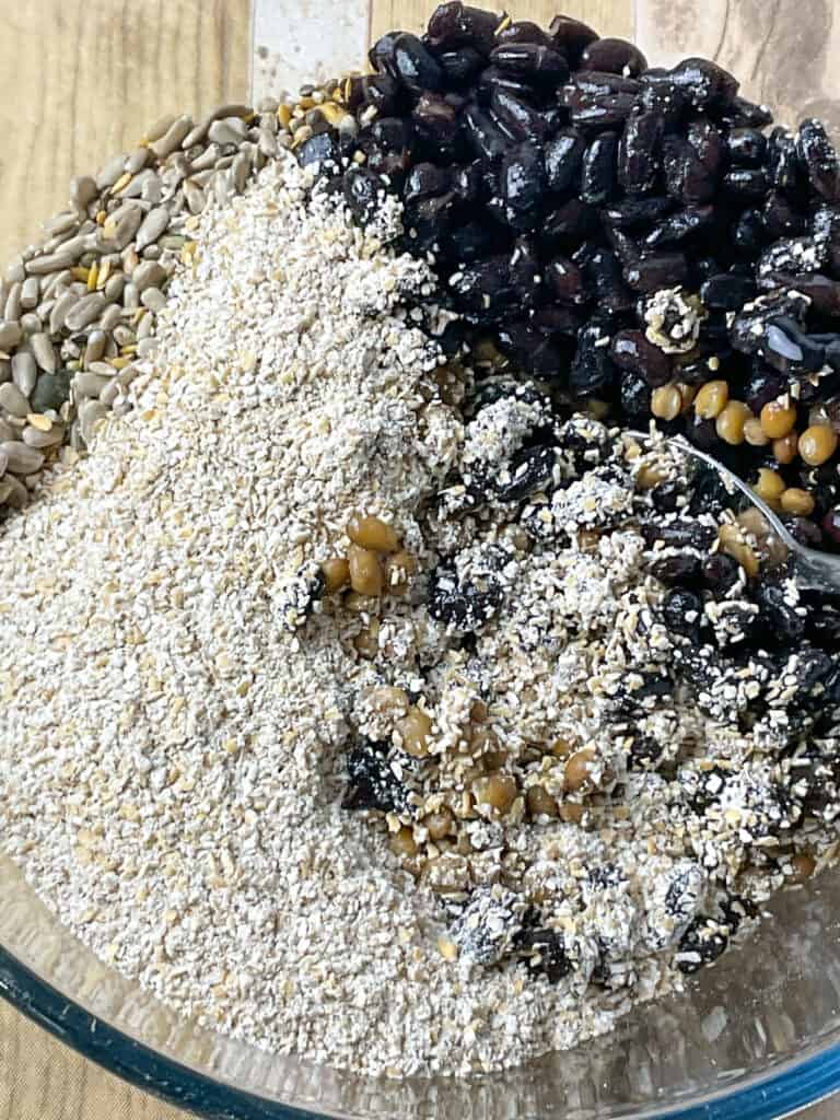 Ingredients for vegan haggis added to mixing bowl.